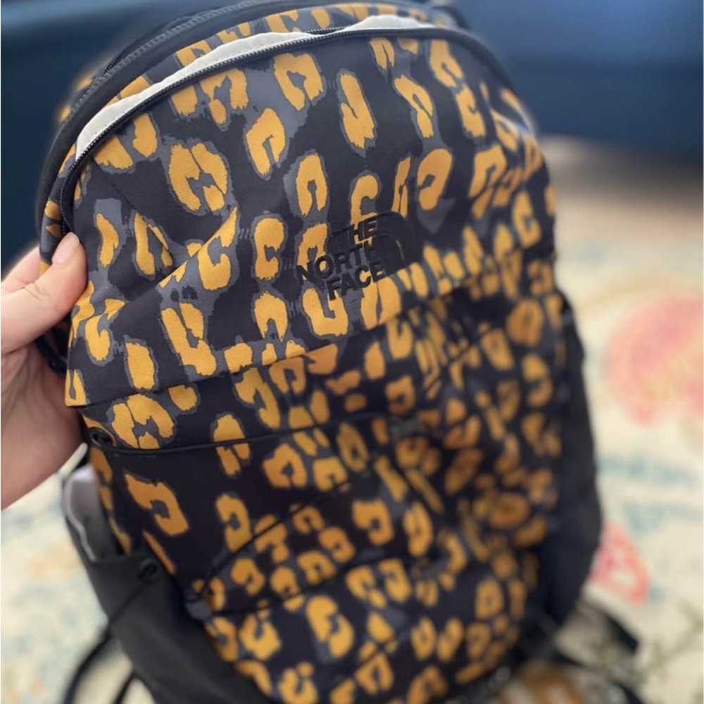 The North Face Black and Yellow Backpack with Bold Design